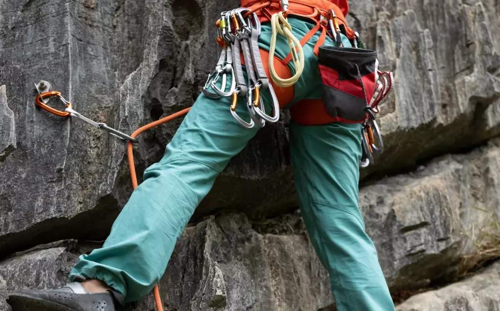 What is belaying in climbing?